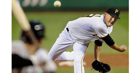 Pirates starter Kevin Correia delivers against the Astros.