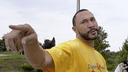 Charlie Batch speaks with reporters outside Monessen High School, where he attended a student assembly to speak about the importance of dignity and respect.