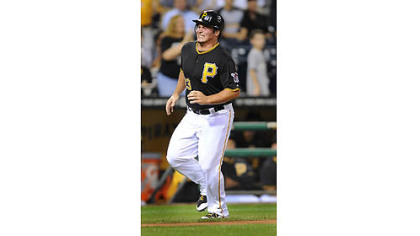 The Pirates' Travis Snider pulls up before crossing home and scoring with an injury that took him out of the game in the first inning against the Astros.