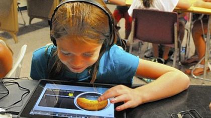 Ella Sticha, 9, works on the "Garage Band" program in music class at McMurray Elementary School.