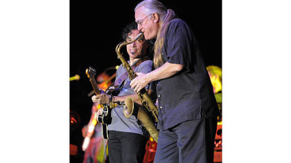 John Oates and Charlie DeChant on saxophone, right.