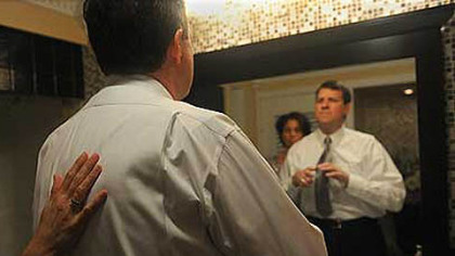 Suzanne Alexander helps Neil tie a new tie before a party in March