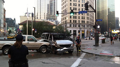 The crash involving a pickup truck and a van shut down a portion of Liberty Avenue at Sixth and Market streets, Downtown.