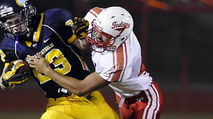 Central Catholic's Luigi Lista-Brinza is brought down by North Hills' Jeffrey Bauman Friday.
