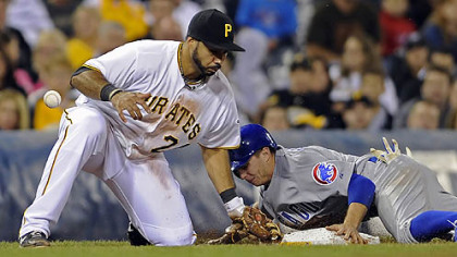 The Cubs' Tony Campana steals third base on the Pirates' Pedro Alvarez in the fifth inning.