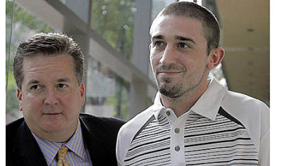 Kenneth W. Smith Jr., right, accompanied by his lawyer Bill Brennan, exits the U.S. Courthouse in Philadelphia on Friday. Mr. Smith, 26, was arrested and is charged with making a false threat that led authorities to recall a plane in midair to the Philadelphia airport.