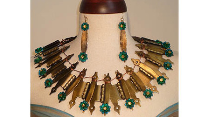 Kathryn Scimone Stanko of Monroeville made a necklace from old cabinet hinges, and beads made by Pittsburgh glass artist Michael Mangiafico.