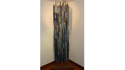 Kelsey McKissock of Turtle Creek made wall art from salvaged pieces of cedar, oak and iron pipe that she split and attached to canvas.