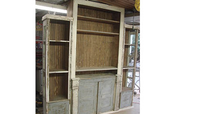 Stephen Palmer of Shelocta used an old cabinet, trim pieces, wainscotting and two old side lights from a front door to make an entertainment center for his mother and father. He painted their names on the piece and the names of their children on the insides of the doors.