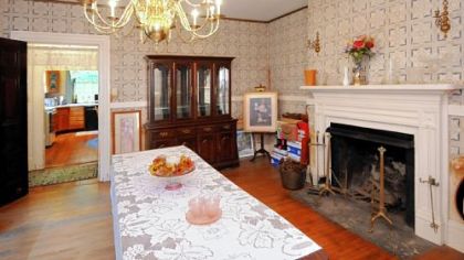 The 18-by-16 dining room sits off of the kitchen and houses a piece of history -- a brass pot that is rumored to have brewed the one of the first batches of Heinz Ketchup -- Sarah Heinz was best friends with Sara Scott (Shaw).