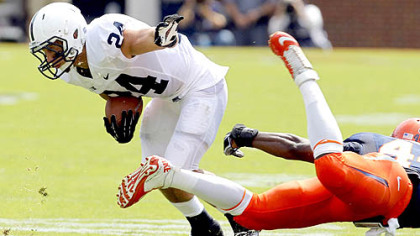 Penn State running back Derek Day (24) breaks a tackle by Virginia's Sammy MacFarlane (44) during the first half of today's game in Charlottesville, Va.
