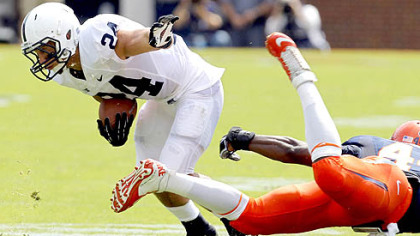 Penn State running back Derek Day  breaks a tackle by Virginia's Sammy MacFarlane in the first half Saturday in Charlottesville, Va.