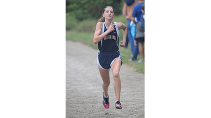 Shaler's Brianna Schwartz took nearly a minute off her personal best time in winning the Red, White & Blue Classic Saturday in Schenley Park.