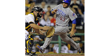 Chicago's Welington Castillo scores the go-ahead run ahead of the throw to Pirates catcher Michael McKenry in the eighth inning Saturday night at PNC Park.