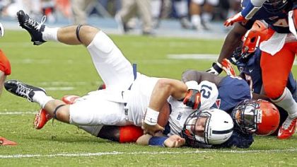 Penn State quarterback Steven Bench (12) is tackled by Virginia linebacker LaRoy Reynolds (9) in the first half Saturday in Charlottesville, Va.