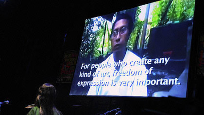 Poet Khet Mar of Burma, a former visiting writer at City of Asylum/Pittsburgh, interviews fellow countryman Nyein Thit by video at the Jazz Poetry Concert.