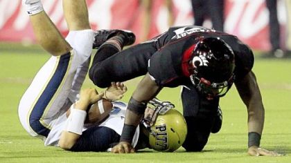 Pitt quarterback Tino Sunseri is sacked by Cincinnati defensive lineman Walter Stewart in the Big East opener for both teams Thursday night in Cincinnati.