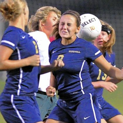 Hopewell defender, Laura Butts, right, misses a header in front of the net against Blackhawk Wednesday night in a WPIAL Class AA Section 3 match. Hopewell defeated Blackhawk, 7-1.