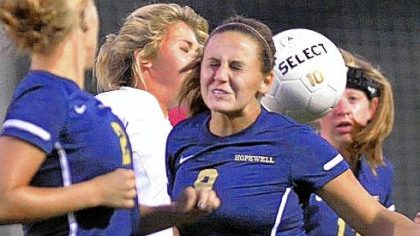 Hopewell defender, Laura Butts, right, misses a header in front of the net against Blackhawk Wednesday night in a WPIAL Class AA Section 3 match. Hopewell defeated Blackhawk, 7-1.