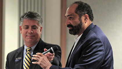 Former Steeler and Penn State alumnus Franco Harris has the microphone taken away from him during an open public forum before the Penn State Board of Trustees in State College today. Harris was not one of the seven people who were chosen in advance to ask questions.