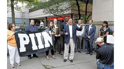 State Rep. Bill Kortz, D-Dravosburg, speaks to protesters near the County Office Building in Downtown Pittsburgh Thursday. Protesters rallied against the state's new voter ID law.