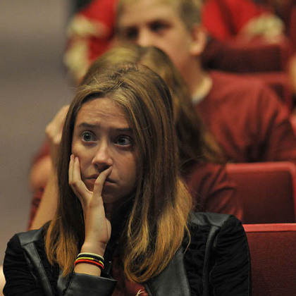 Gypsy Fillinger, 13, an 8th grade student at New Brighton Middle School, watches a news footage about the Columbine shootings during a presentation about Rachel's Challenge.