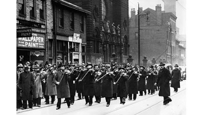 This Pittsburgh Press photo, dated Feb. 26, 1940, shows gypsy violinists playing in a funeral procession in Braddock just outside St. Thomas Catholic Church. The image appears in Steve Piskor''s new book, "Gypsy Violins: Hungarian/Slovak Gypsies in America."