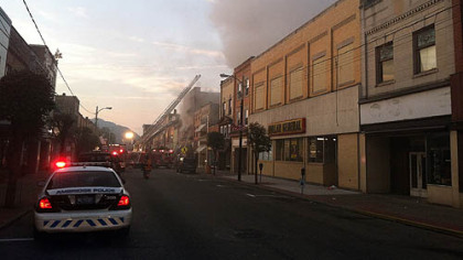 The fire early this morning along Merchant Street in Ambridge forced residents to flee though heavy smoke.