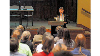 Katie Hogan, chairwoman of the women's studies program at Carlow University, introduces the film "Miss Representation" to a full auditorium in a program Friday celebrating the 40th anniversary of the women's studies program at the university.