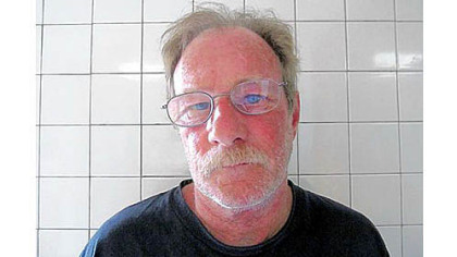 Michael Eugene Brewster is pictured in a booking photo taken Thursday.