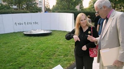 Maureen and Daniel Murphy, parents of Lt. Michael P. Murphy, read a small card left at the Penn State Veterans Plaza, which opened Friday. The plaza is dedicated to Lt. Murphy.