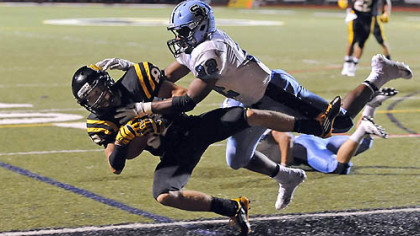 North Allegheny's Gregg Garrity scores a touchdown Friday against Seneca Valley's Forrest Barnes.