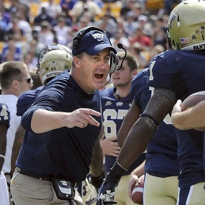 Paul Chryst congratulates Ray Graham after one of Graham's three touchdown runs. Chryst earned his first win as a collegiate head coach in the Panthers' upset of No. 13 Virginia Tech.