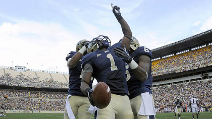Pitt's Ray Graham celebrates a touchdown against Virginia Tech with teammates Devin Street and Drew Carswell in the third quarter Saturday at Heinz Field.