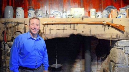David Pancake stands in front of the original fireplace in his home built in 1780, outside Romney in Hampshire County, W.Va.