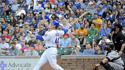 The Cubs' Anthony Rizzo hits a grand slam home run against the Pirates in the sixth inning.