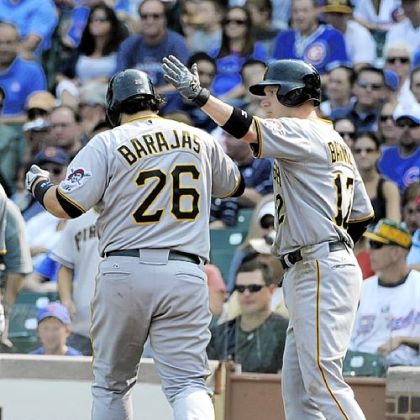 Catcher Rod Barajas is greeted by Clint Barmes after hitting a two-run homer Sunday against the Chicago Cubs at Wrigley Field.