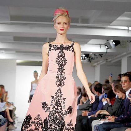 Daria Strokous modeling an outfit for the presentation of the Oscar de la Renta Spring 2013 collection.