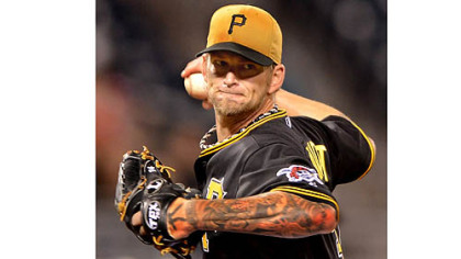 Pirates starter AJ Burnett delivers against the Brewers
