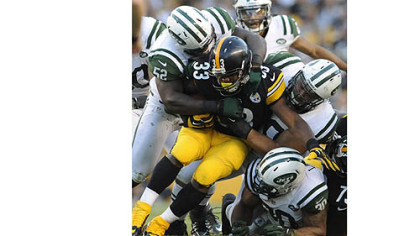 Isaac Redman is stacked up in  the third quarter Sunday at Heinz Field. The Steelers have averaged just 2.6 yards a carry in their first two games.