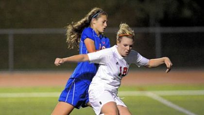 Peters Township's Veronica Latsko, front, lines up a shot against Chartiers Valley's Emily Tolmer Wednesday in a 7-1 win.