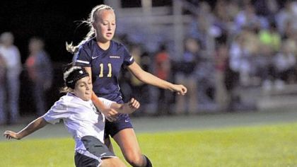 Blackhawk's Lia Vincuguerra kicks the ball away from Hopewell midfielder Abby Losco, right, during a section match last week.