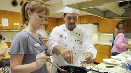 Amanda Petrovich of Fox Chapel cooks with Stephen J. Grottenthaler, executive chef of Pittsburgh Field Club, in the Cooking Heart Healthy Dishes II class. Fox Chapel Adult Education marks its 50-year anniversary.