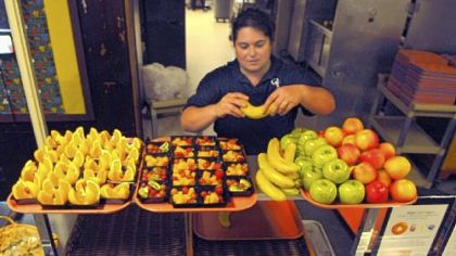 Samantha Hiller arranges fresh fruit for seventh- and eighth-graders in the Quaker Valley School District.