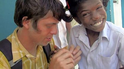 In India, Rocky Braat puts a bandage on Subbu in the documentary "Blood Brother," a story about an Ohio native who lands at an orphanage in India that houses children with with HIV and AIDS.