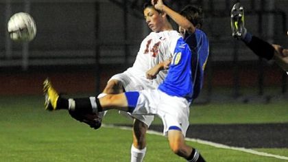 Upper St. Clair's Ethan Dysert, left, fights for the ball with Canon-McMillan's Corey McCurdy Sept. 11. Dysert, a senior captain, leads a strong group of forwards for the Panthers.