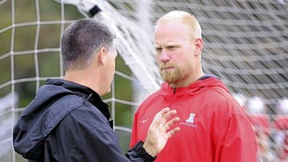 Avonworth assistant coach Chris Hoke, right, talks with head coach Duke Johncour at practice Tuesday.