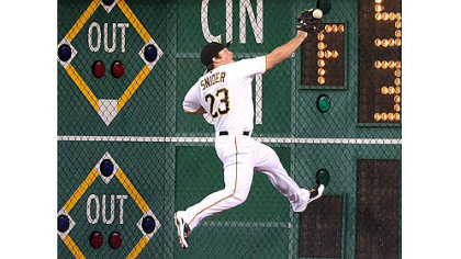 Pirates right fielder Travis Snider crashes in to the right field wall on double hit by the Brewers' Norichika Aoki to score the first run in Milwaukee's four-run rally in the eighth inning Thursday at PNC Park.