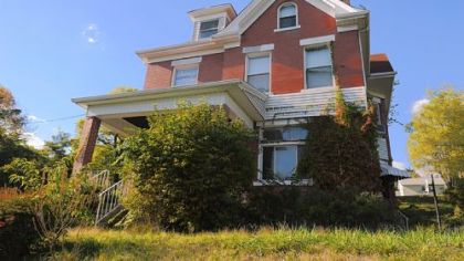 This five-bedroom, three-story brick house in West Mifflin is on the market for $109,900.