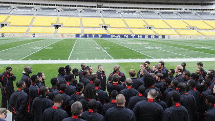 Gardner-Webb coach Ron Dickerson Jr.speaks to his team  at Heinz Field as he leads his team through a walkthrough Friday.